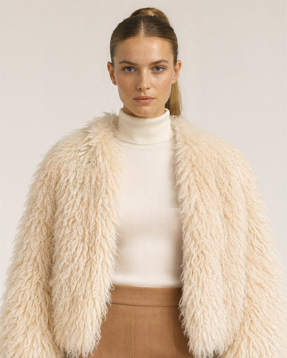Lavinia Long Curly Pile Faux Fur Cropped Jacket, apricot cream, close up above the waist