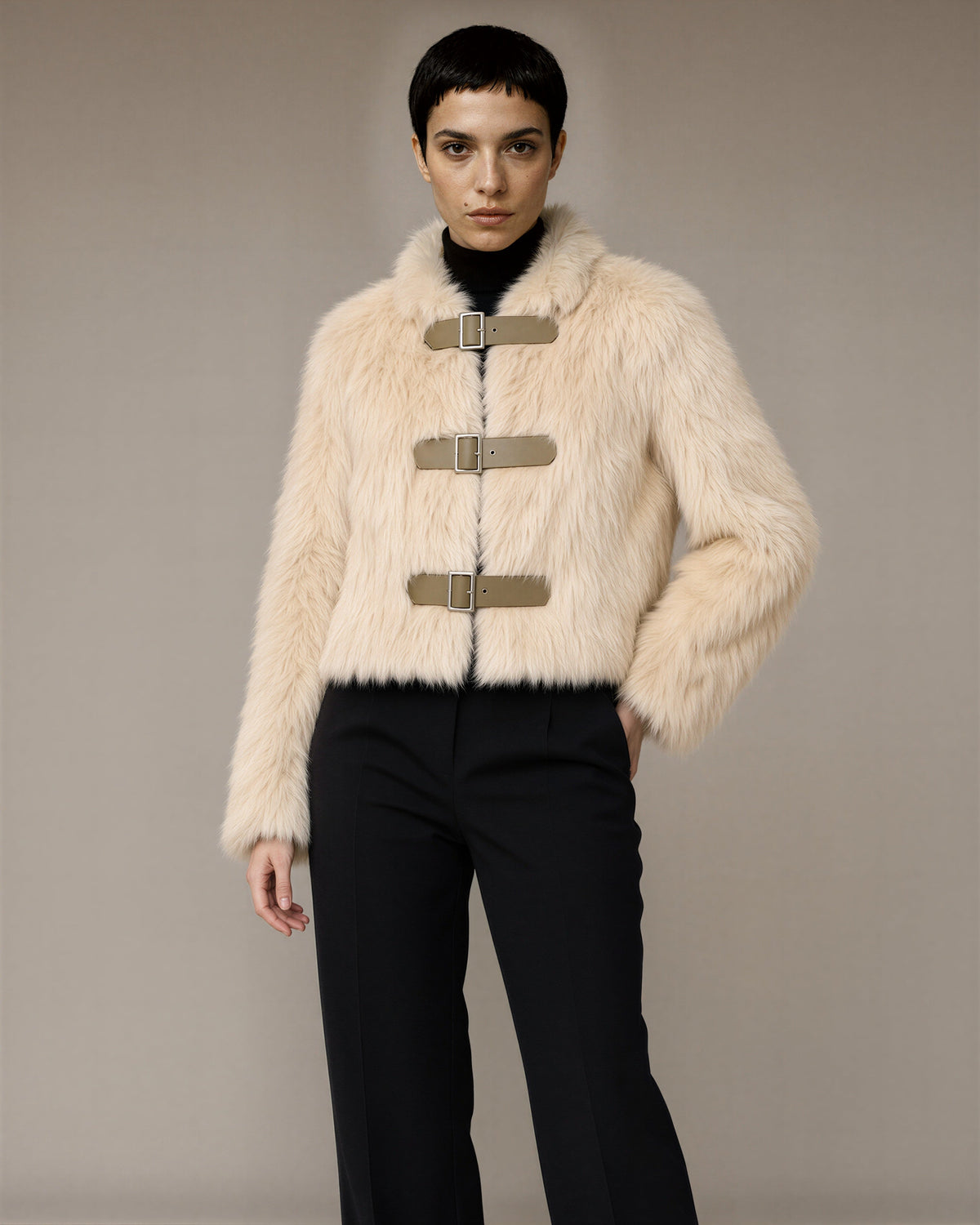 Nella Buckled Cropped Faux Fur Jacket, cream, front, hands on the waist